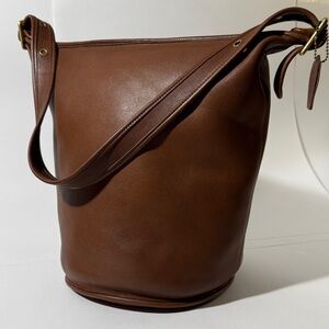 COACH Vintage British Tan Duffle Sac. 
Hang Tag. 
Gently Loved.